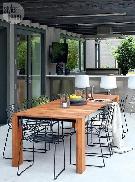 Modern patio teak table and metal chairs