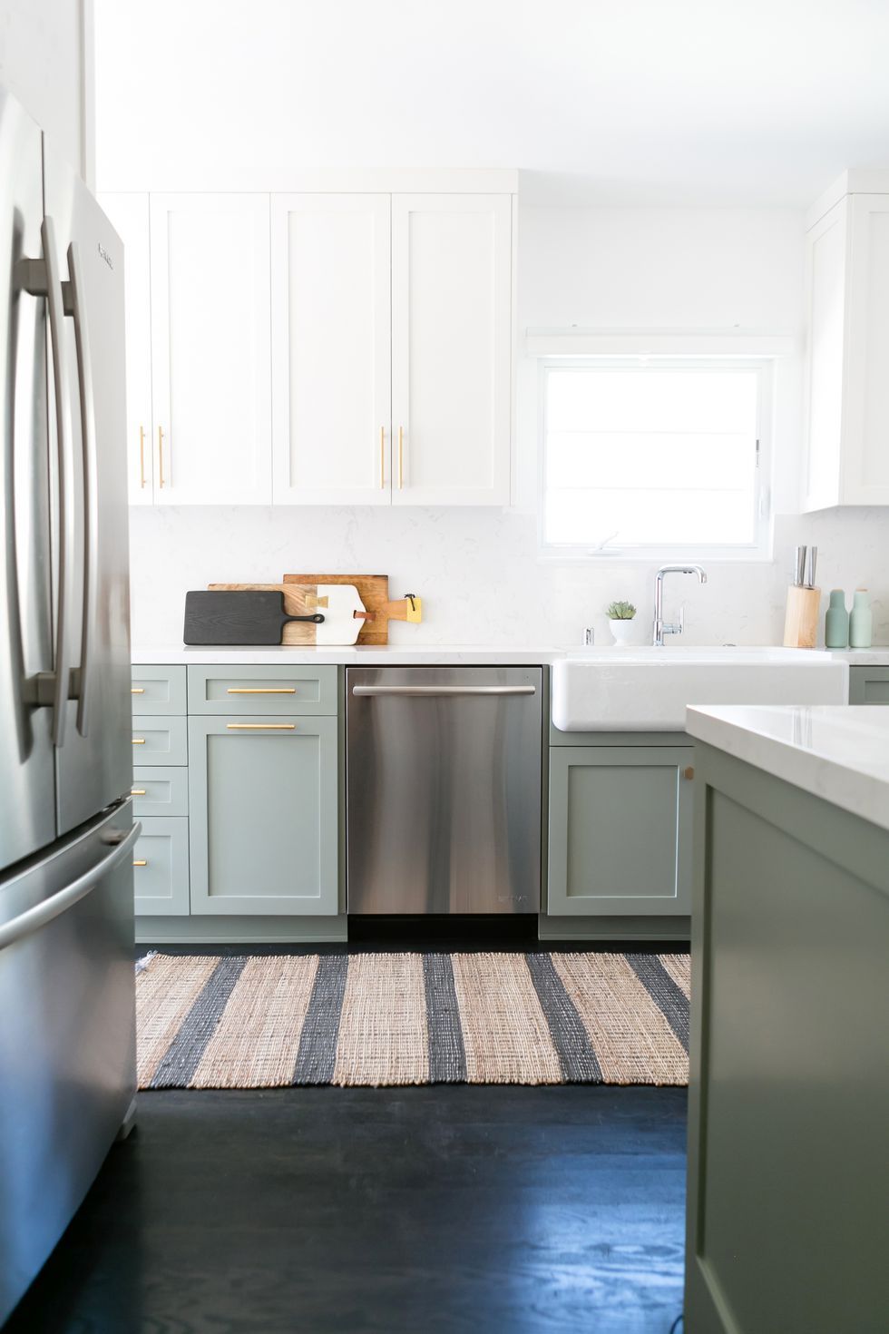 green and white kitchen with sink